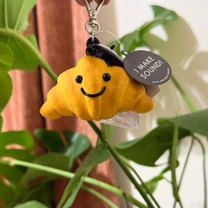 Bath & Body Works Yellow Smiling Croissant Sound Keychain